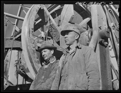 Moore County, Texas. Cable tool driller and helper