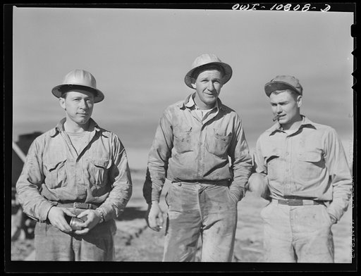 Untitled photo, possibly related to: Moore County, Texas. Adding another length of pipe during rotary drilling operations