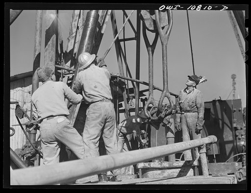 Moore County, Texas. Adding another length of pipe during rotary drilling operations