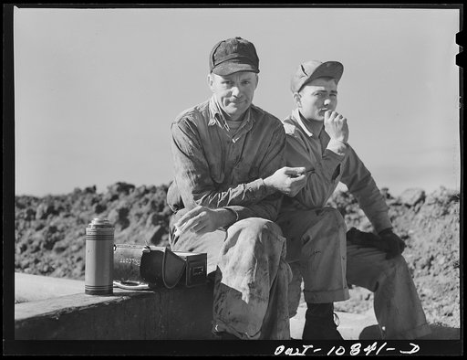 Untitled photo, possibly related to: Moore County, Texas. Driller and two roughnecks on portable rotary drilling outfit.