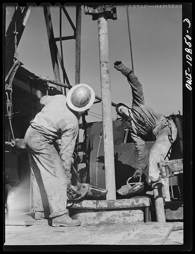 Moore County, Texas. Adding length of pipe during rotary drilling operations