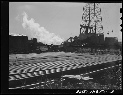 Moore County, Texas. Well being drilled by cable tool method; the drill pipe is in the foreground