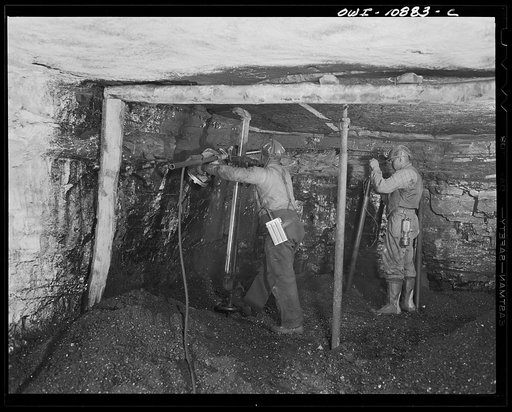 Pittsburgh, Pennsylvania (vicinity). Montour no. 4 mine of the Pittsburgh Coal Company. Undercutting the face, while a miner wires up a Cordox shell before blasting