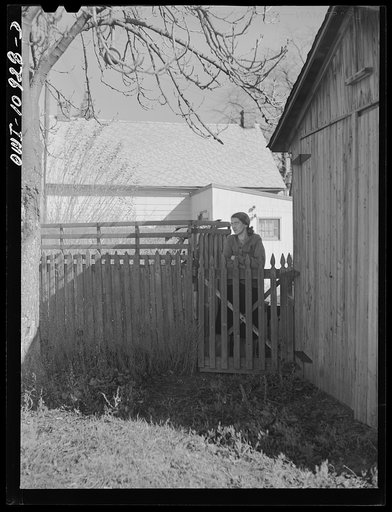 Manheim, Pennsylvania. Woman at her back gate