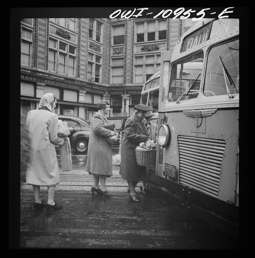 Lancaster, Pennsylvania. Boarding buses on a rainy market day