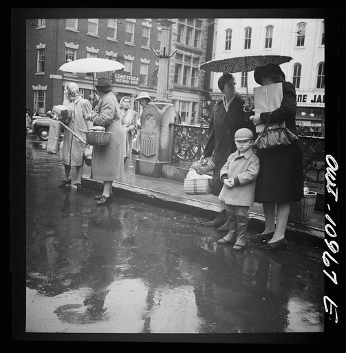 Lancaster, Pennsylvania. Waiting for buses on a rainy market day