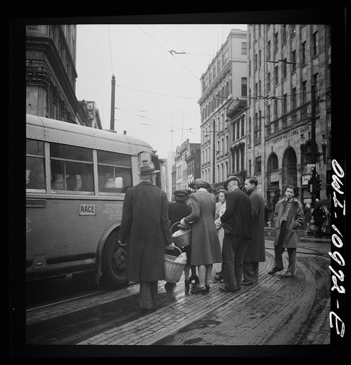 Lancaster, Pennsylvania. Boarding buses on a rainy market day