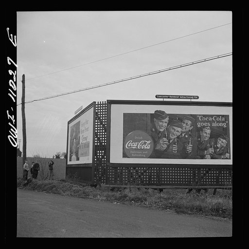 Untitled photo, possibly related to: Lititz (vicinity), Pennsylvania. Boys playing near a billboard. Most of their fathers work in nearby defense plants