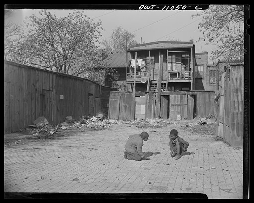 Washington (southwest section), D.C. Two Negro boys shooting marbles in front of their homes