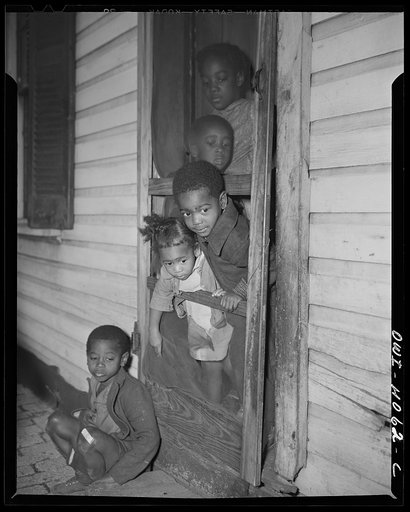 Washington (southwest section), D.C. Negro children in the front door of their home