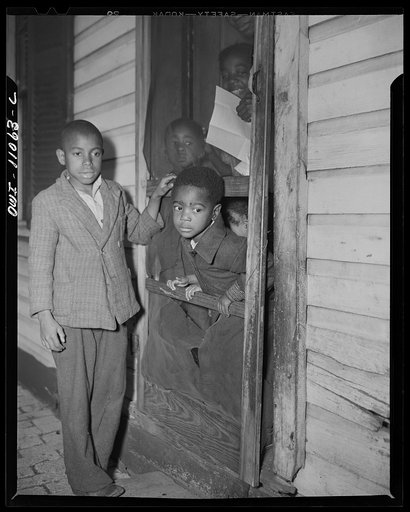 Washington (southwest section), D.C. Negro children in the front door of their home