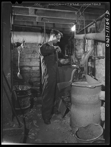 Lititz, Pennsylvania. This town of 4000-odd inhabitants, has two weekly papers, the oldest of which is the Record-express. Pouring molten metal, to make plates from mats in the basement of the Record-express office building