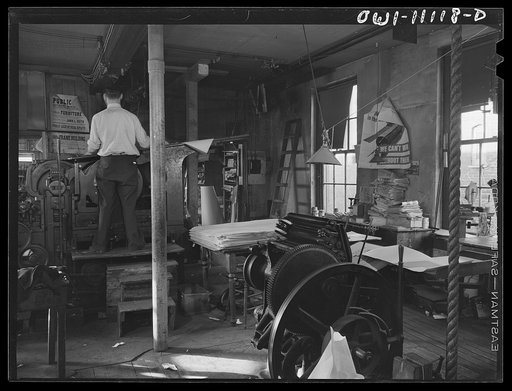 Lititz, Pennsylvania. Press room of the Lititz Record-express printing company as the paper comes off the press in the foreground. Smaller presses are for other printing jobs which are becoming more and more necessary in order to keep the paper solvent, because national advertising has practically s