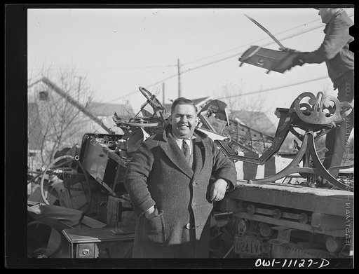 Lititz, Pennsylvania. A furniture dealer, who is chairman of the salvage committee, supervising the scrap collection. The object at right is a dentist's chair