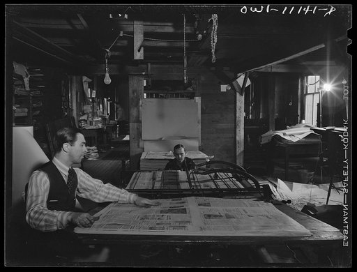 Untitled photo, possibly related to: Lititz, Pennsylvania. William N. Young, publisher of the Record-express, is also its reporter and advertising man. The star shows that one of his usual four employees is already in the service. Many printers can get better wages in defense work, and the paper may