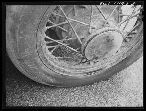 Lancaster, Pennsylvania. Tire on a car in a parking lot is marked with name of its owner to deter thieves