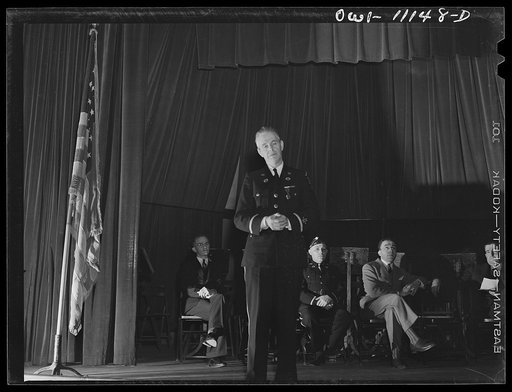 Lititz, Pennsylvania. State American Legion official making a patriotic speech at the Lilitz Armistice Day gathering. The burgess of the borough (right) and local legionnaires (in background)