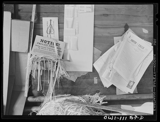 Lititz, Pennsylvania. Lititz Springs Pretzel Company, owned by Lewis C. Haines (background) who is unloading a tray of pretzels which has come up on a dumb waiter from the baking room below. His son Bob weighs them and packs them in cans. Lititz was the first town in America where pretzels were made