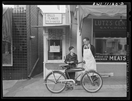 Untitled photo, possibly related to: Peanut stand next to the Lutz butcher shop finds it hard to get peanuts since the war started. Peanut oil is needed in industry