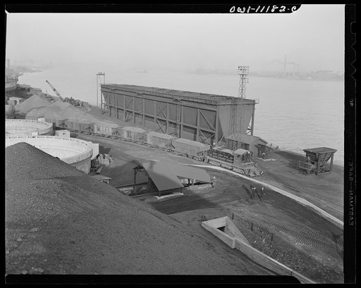 Hanna furnaces of the Great Lakes Steel Corporation. Detroit, Michigan. Coke being transported to stockpiles from a coke oven