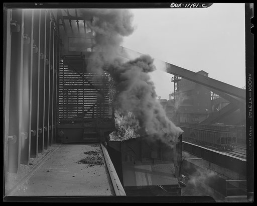 Hanna furnaces of the Great Lakes Steel Corporation. Detroit, Michigan. Coke being pushed into a quenching car