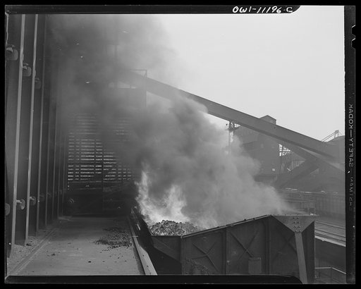 Untitled photo, possibly related to: Hanna furnaces of the Great Lakes Steel Corporation. Detroit, Michigan. Coke being pushed into a quenching car