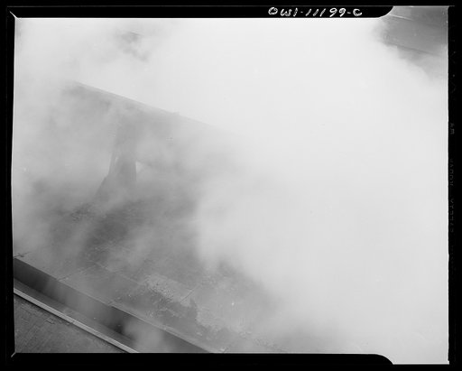 Untitled photo, possibly related to: Hanna furnaces of the Great Lakes Steel Corporation. Detroit, Michigan. Coke being pushed into a quenching car