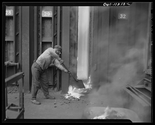 Hanna furnaces of the Great Lakes Steel Corportation. Detroit, Michigan. Cleaning out loose coke after removing a door preparatory to putting door back