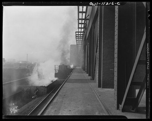 Hanna furnaces of the Great Lakes Steel Corporation. Detroit, Michigan. Electric car near a dumping pit