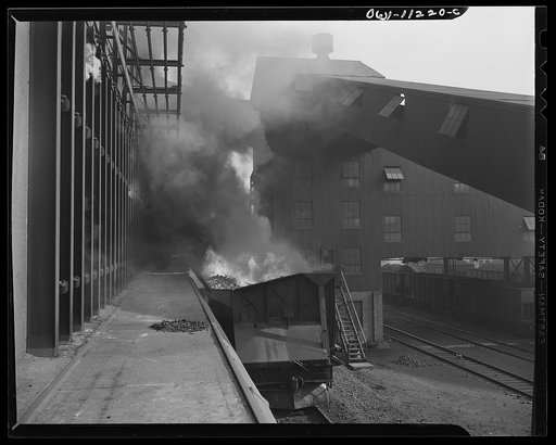 Hanna furnaces of the Great Lakes Steel Corporation. Detroit, Michigan. Freight car loaded with flaming coke