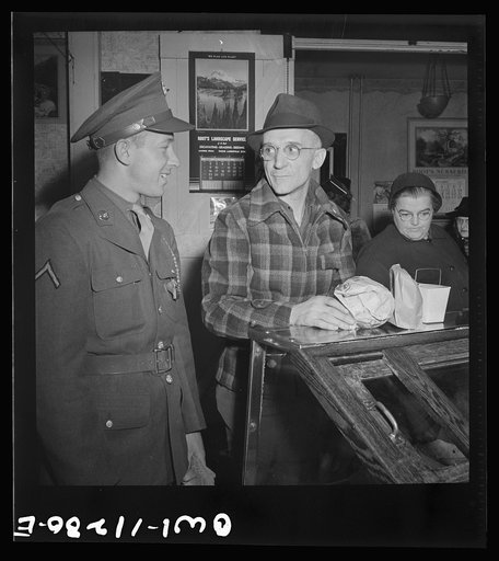 Lititz, Pennsylvania. Private first class Fred D. Long, home on leave from Fort Bliss, Texas, goes shopping with his father, Albert K. Long, who works in the animal trap company's machine shop