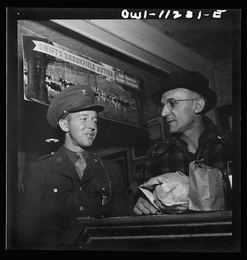 Lititz, Pennsylvania. Private first class Fred D. Long, home on leave from Fort Bliss, Texas, goes shopping with his father, Albert K. Long, who works in the animal trap company's machine shop
