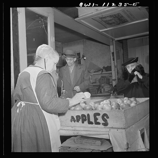 Untitled photo, possibly related to: Lititz, Pennsylvania. Mennonite farmer's wife at the farmers' market