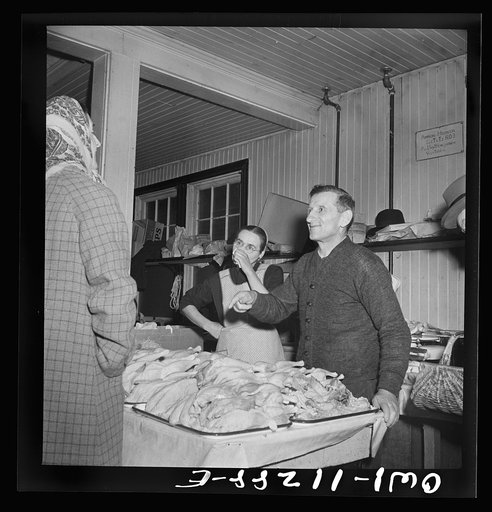 Lititz, Pennsylvania. Mennonite farmer and wife selling fowl at the farmers' market
