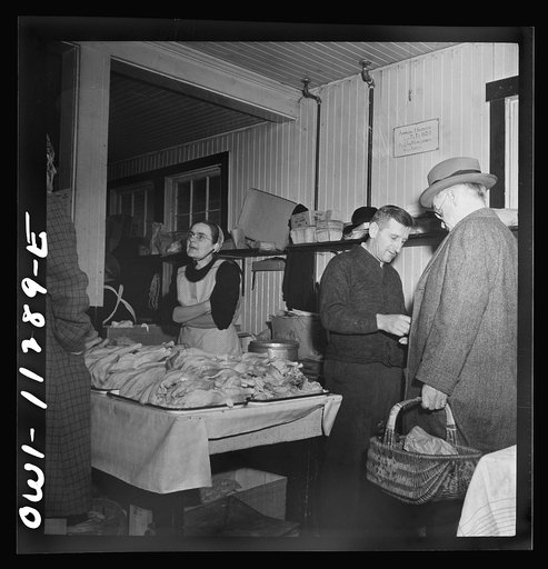 Lititz, Pennsylvania. Mennonite farmer and wife selling fowl at the farmers' market