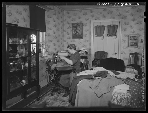 Untitled photo, possibly related to: Lititz (vicinity), Pennsylvania. Mennonite farmer's wife dressmaking