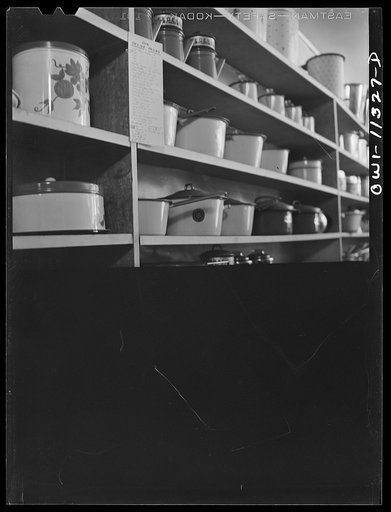 Untitled photo, possibly related to: Lititz, Pennsylvania. These are the last aluminum and enamel ware utensils which Morris Kreider's hardware store will be able to get for the duration of the war. Usually he keeps his storeroom as well as the shelves well stocked