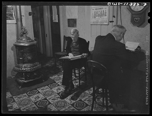 Lititz, Pennsylvania. Offices of Mr. Elam Habecker (right), a real estate man, and Secretary of Lititz borough. Walter Miller, who has been superintendent of water works for forty-three years, dictating water bills to Habecker, who types them