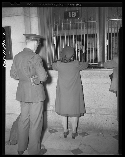 Washington, D.C. Soldiers and a civilian purchasing tickets at the Union Station