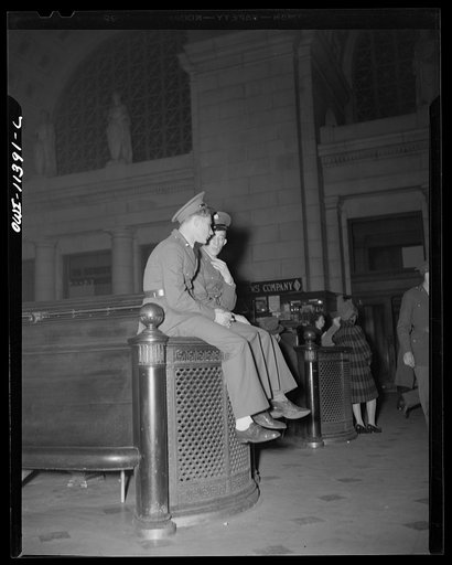 Washington, D.C. Two soldiers await the arrival of a troop train at the Union Station
