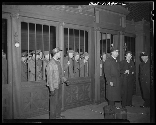 Washington, D.C. Soldiers waiting to be let through the gate to trains at the Union Station