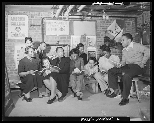 Washington, D.C. First aid class of the air raid warden unit in the Southwest area. Mr. Elmer House, instructor, listening to an oral recitation by members of the class