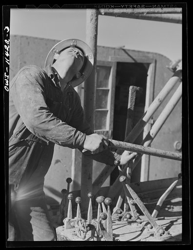 Untitled photo, possibly related to: Sherman County, Texas. Roughnecks on core drilling crew for the Phillips Petroleum Company