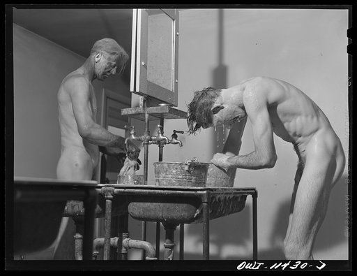 Untitled photo, possibly related to: Sunray, Texas. Carbon black plant workers washing up at the end of the day