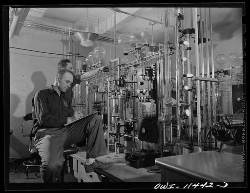 Borger, Texas. Chemist conducting analysis of aviation fuel at the Phillips refinery