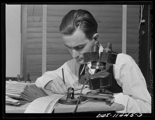 Amarillo, Texas. Geologist making a log of a well from examination of cutting taken from different depths during the drilling of the well by the Phillips Petroleum Company