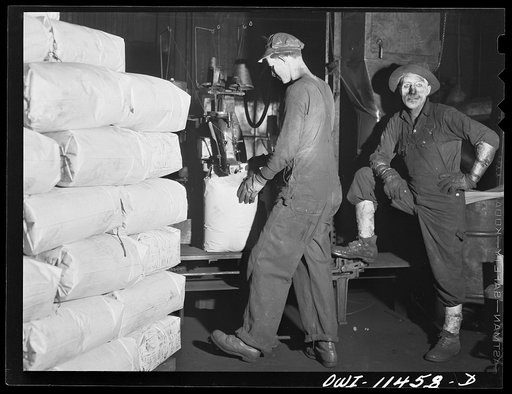 Sunray, Texas. Sacking carbon black in a plant. Carbon black is worth 3 1/2 cents a pound