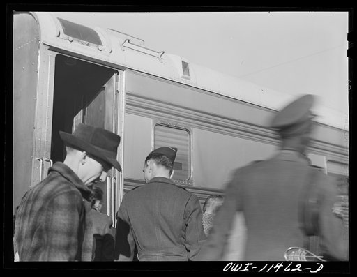 Untitled photo, possibly related to: Amarillo, Texas. Soldiers and civilians boarding the Rock Island Rocket