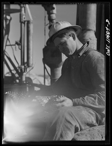 Untitled photo, possibly related to: Sherman County, Texas. Roughneck on a core drilling crew