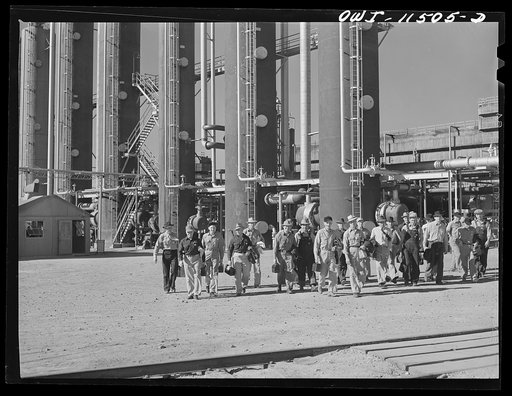Phillips refinery. Borger, Texas. Workers leaving the plant at a change of shift